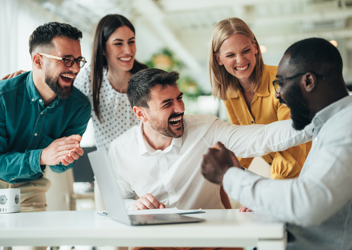 Colleagues enjoying a successful moment together