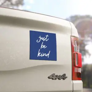 Blue Just Be Kind car magnet with handwritten white text